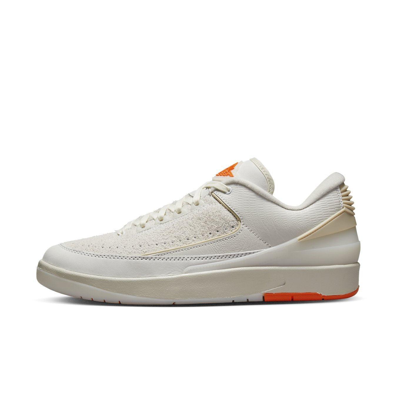 Jordan 2 Retro Low Shelflife sneaker in white and orange, showcasing modern design and sporty style.