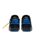 Rear view of Jordan 2 Retro Low SP Off-White in black and blue with exposed foam tongue and lizard texture.