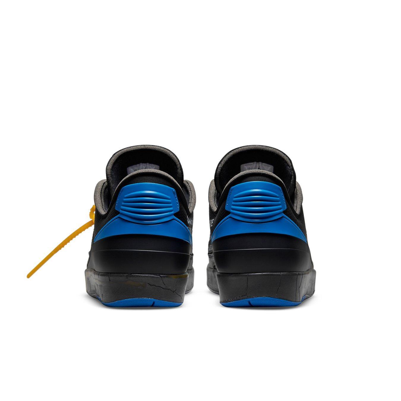 Rear view of Jordan 2 Retro Low SP Off-White in black and blue with exposed foam tongue and lizard texture.