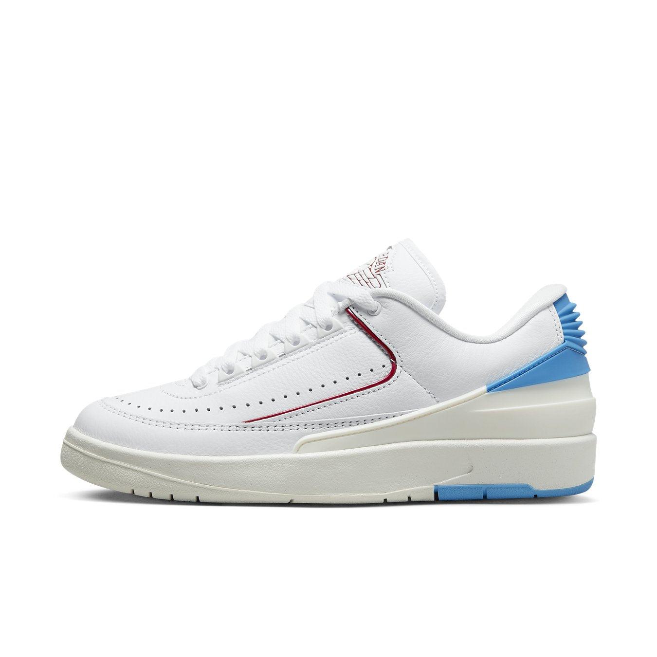 Jordan 2 Retro Low UNC To Chicago (W) in white, red, and dark blue, showcasing premium leather and college-inspired design.