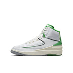 Air Jordan 2 Retro Lucky Green GS sneakers with white leather and Lucky Green accents side view.