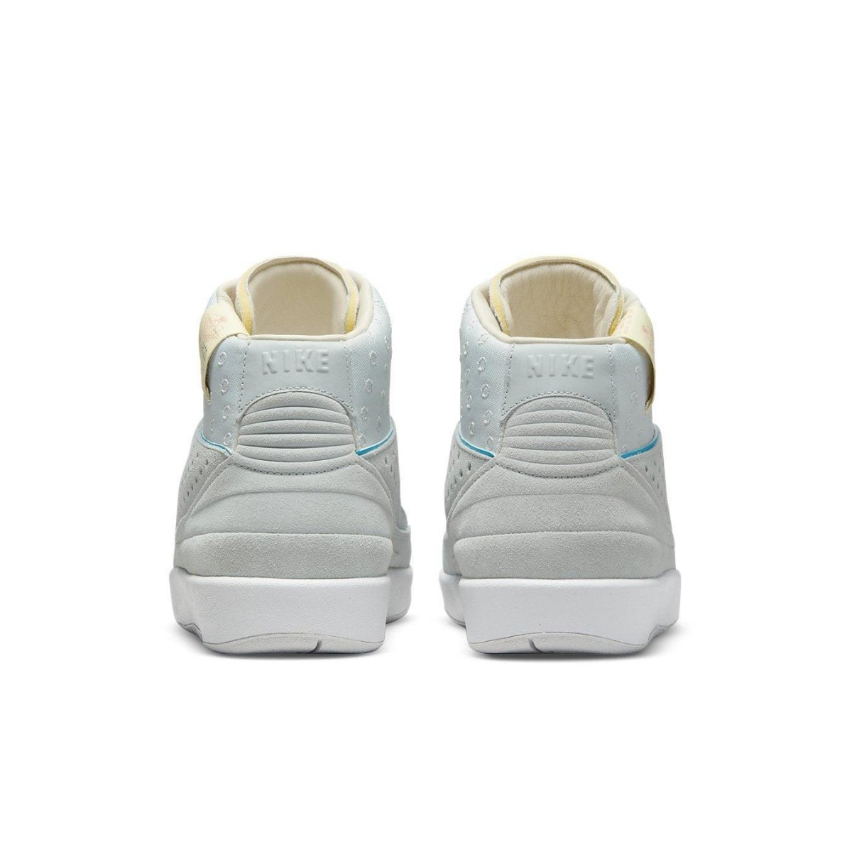 Rear view of Jordan 2 Retro SP Union Grey Fog sneakers featuring a light blue and grey suede upper.