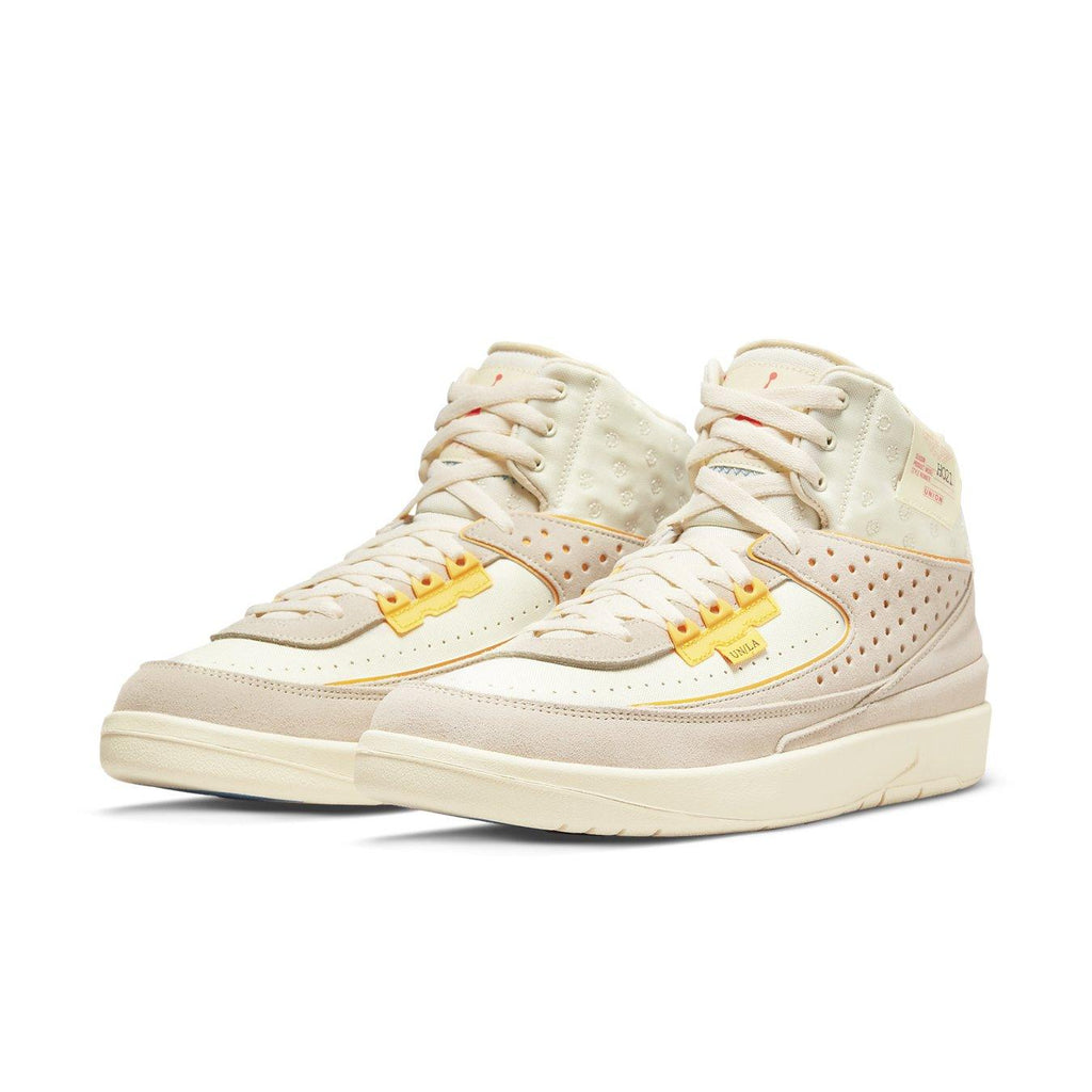 Jordan 2 Retro SP Union Rattan sneakers in beige and yellow, showcasing distinctive design and stylish details.