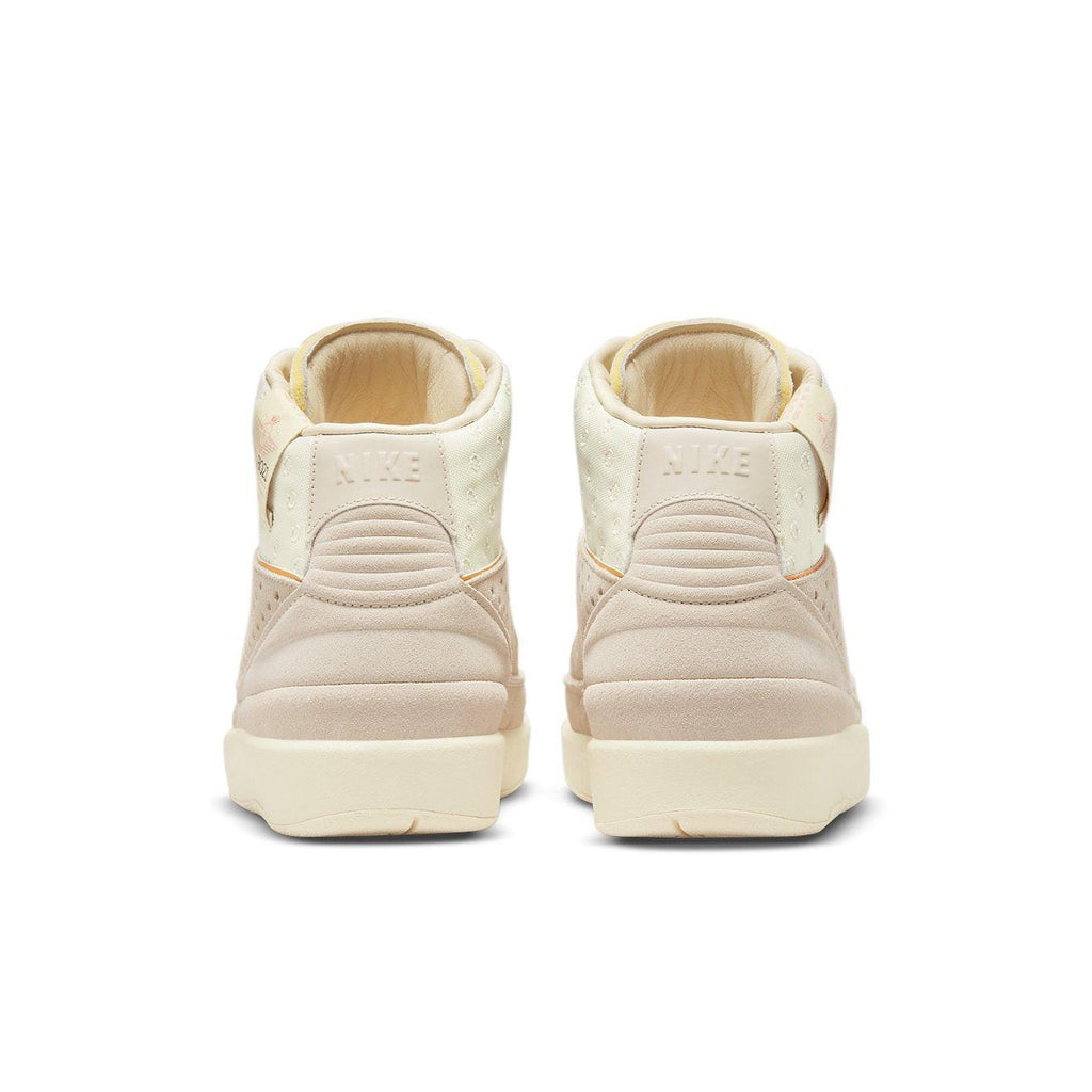 Back view of the Jordan 2 Retro SP Union Rattan sneakers showcasing soft beige and cream colorway.