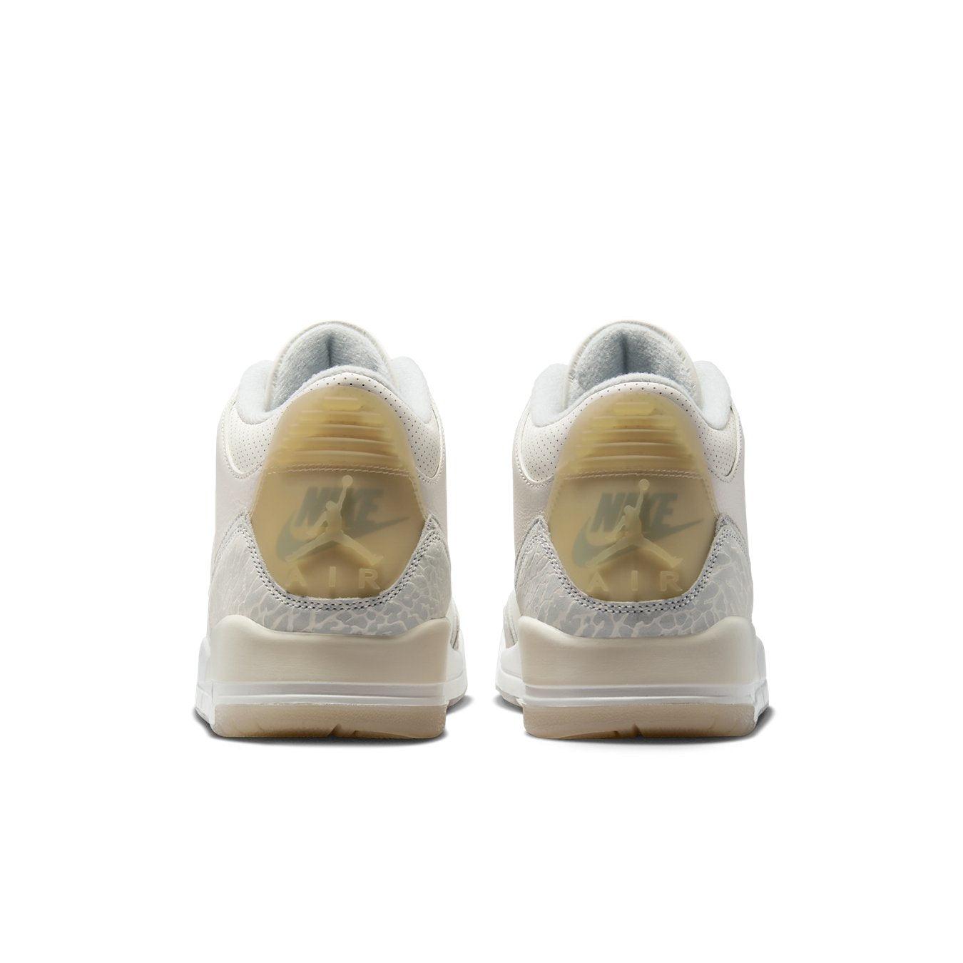 Air Jordan 3 Retro Craft Ivory sneakers, rear view showcasing soft ivory and gray textures.