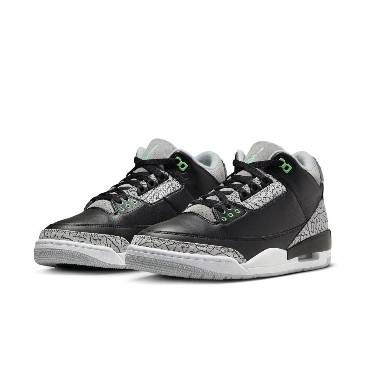 Jordan 3 Retro Green Glow sneakers featuring black leather upper and grey mesh with subtle green accents.