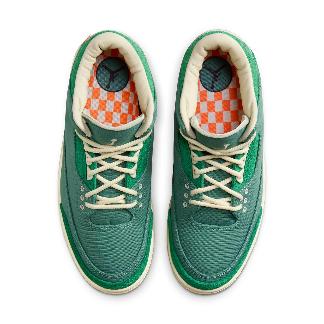 Top view of the Jordan 3 Retro SP Nina Chanel Abney Bicoastal sneakers, featuring green suede and orange checkerboard lining.
