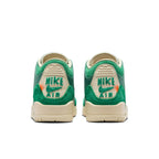Nike Air sneakers featuring bold green colorway and contrasting 'Nike Air' branding on the heel supports.