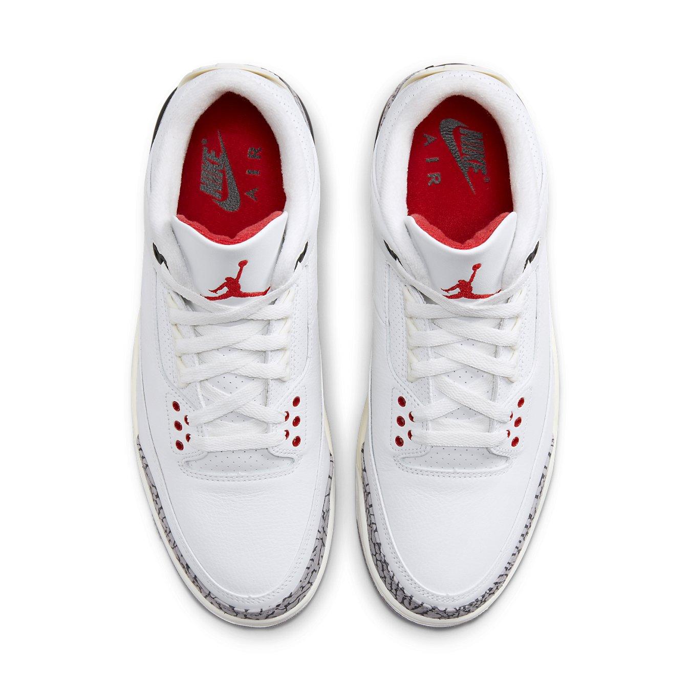 Air Jordan 3 Retro White Cement Reimagined sneakers, featuring white leather upper and iconic elephant print details.