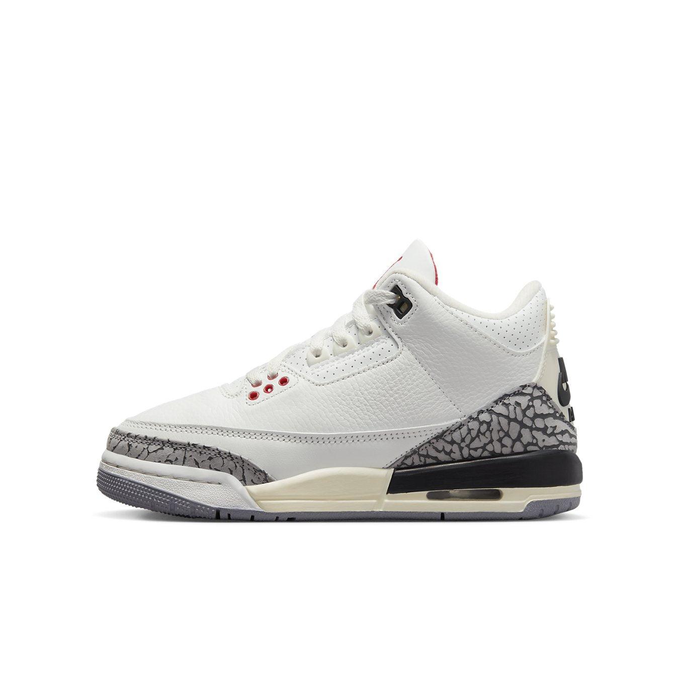 Air Jordan 3 Retro White Cement Reimagined GS sneaker in white leather with grey accents and red Jumper logo.