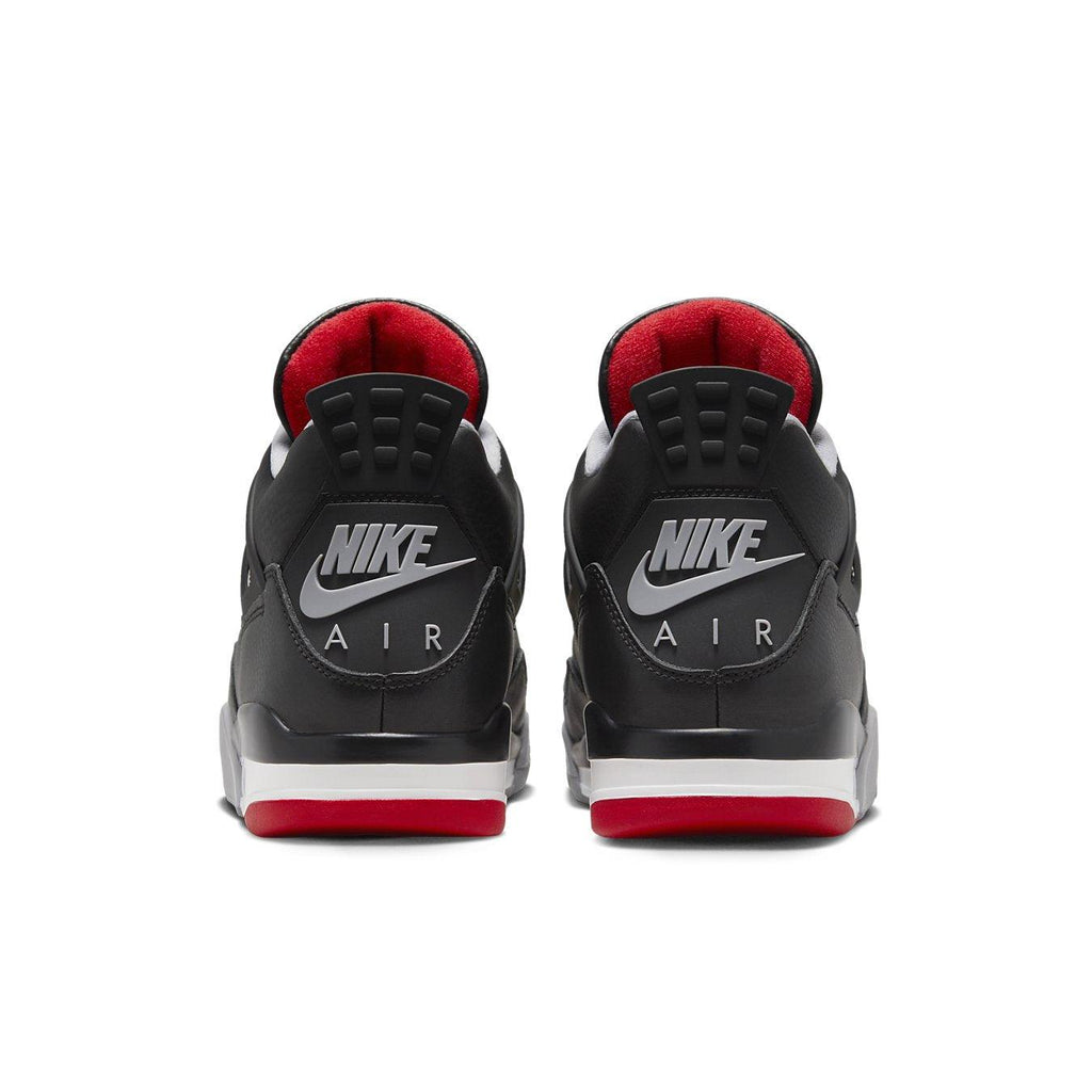 Rear view of Nike Air Jordan 4 Retro Bred Reimagined sneakers showcasing sleek black and red design.