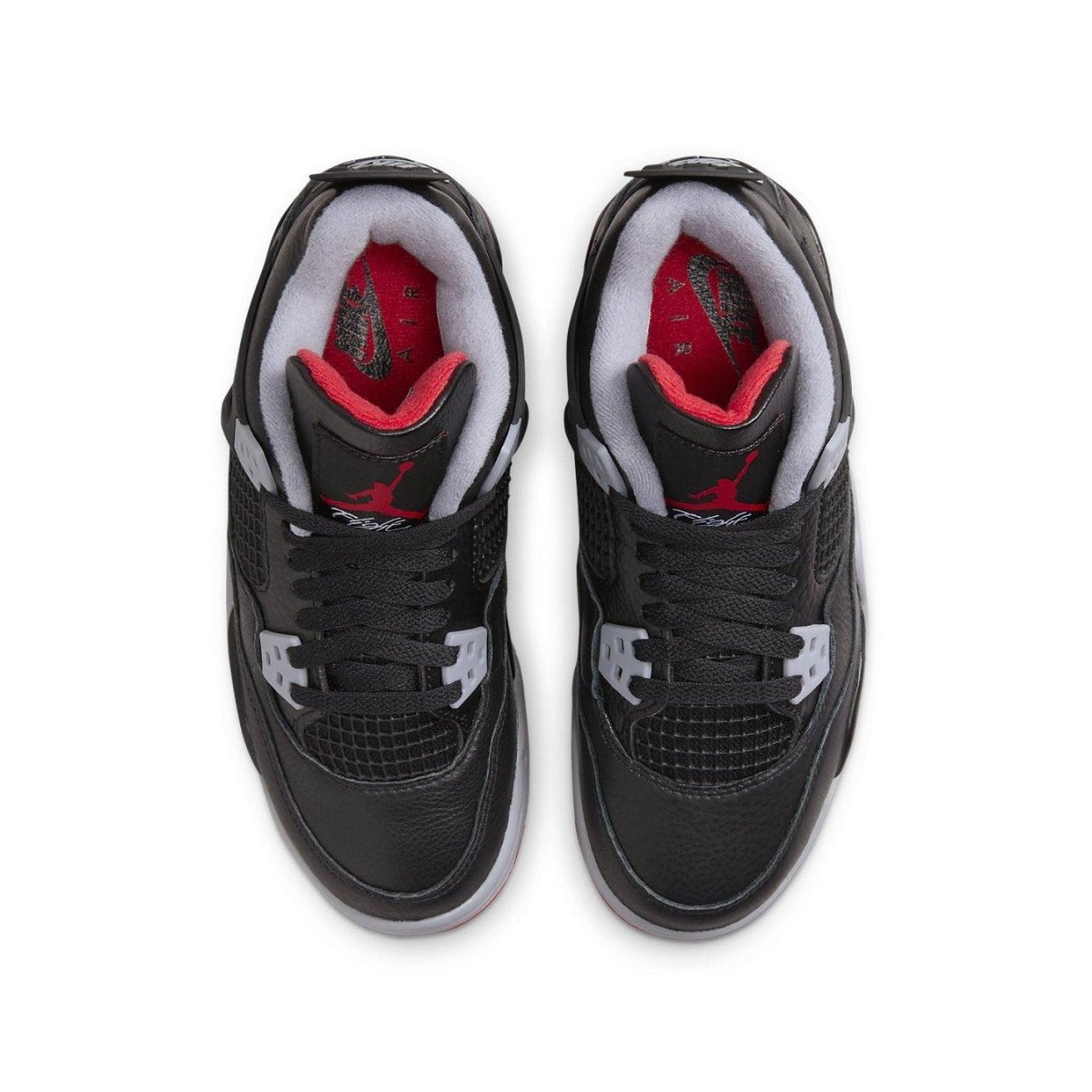 Top view of Air Jordan 4 Retro Bred Reimagined GS sneakers with black leather and red accents.