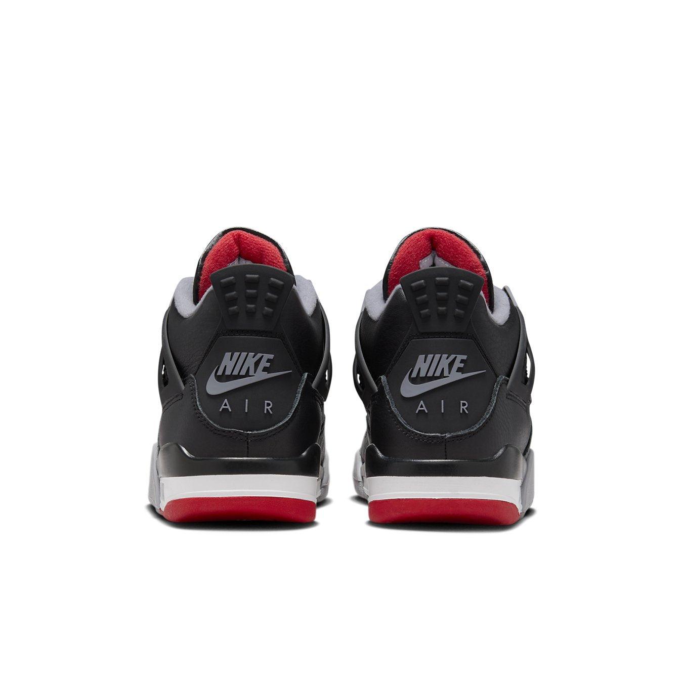 Back view of Nike Air Jordan 4 Retro Bred Reimagined GS showcasing black leather and red accents.