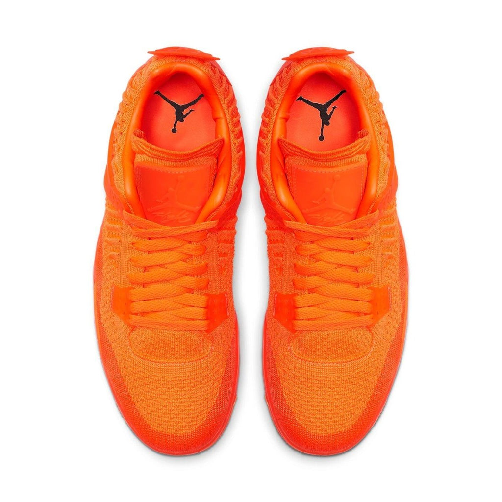Air Jordan 4 Retro Flyknit in Total Orange, featuring a sleek Flyknit upper design.