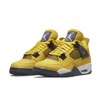 Air Jordan 4 Retro Lightning (2021) sneakers in Tour Yellow with Dark Blue Grey accents.