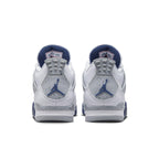 Air Jordan 4 Retro Midnight Navy shoes, featuring a white leather upper, navy accents, and iconic Jumpman logos.