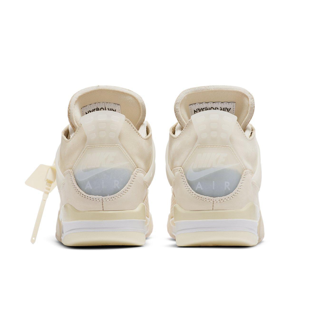Back view of women's Jordan 4 Retro Off-White Sail sneakers with off-white leather and translucent TPU details.