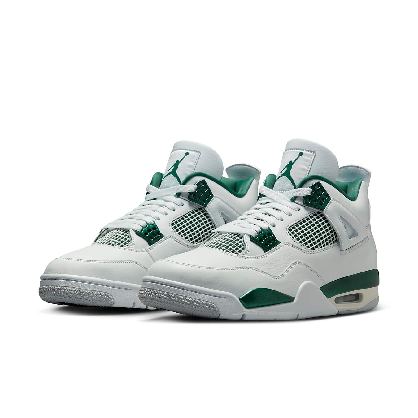 Jordan 4 Retro Oxidized Green sneakers featuring a sleek white leather upper and vibrant green accents.