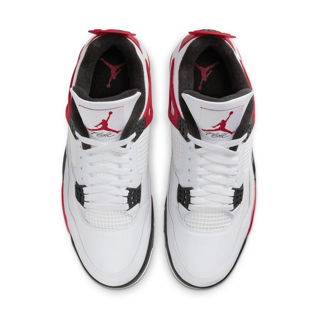 Air Jordan 4 Retro Red Cement sneakers, featuring white leather and Fire Red accents, overhead view.