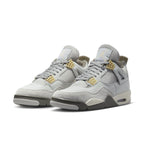 Air Jordan 4 Retro SE Craft Photon Dust shoes in light gray and beige suede with iconic design elements.