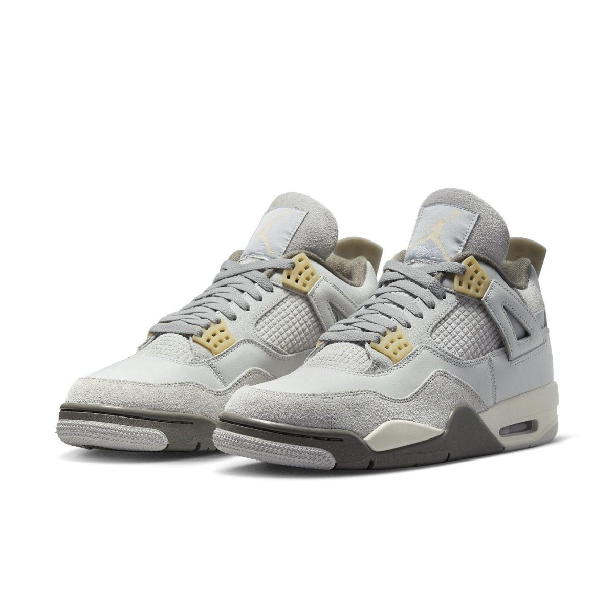 Air Jordan 4 Retro SE Craft Photon Dust shoes in light gray and beige suede with iconic design elements.