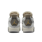 Air Jordan 4 Retro SE Craft Photon Dust shoes, showing light gray leather back view with gold accents.