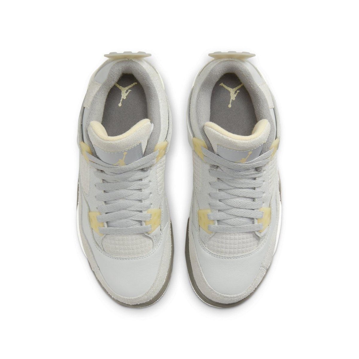 Air Jordan 4 Retro SE Craft Photon Dust sneakers for kids, featuring light gray upper and yellow accents.