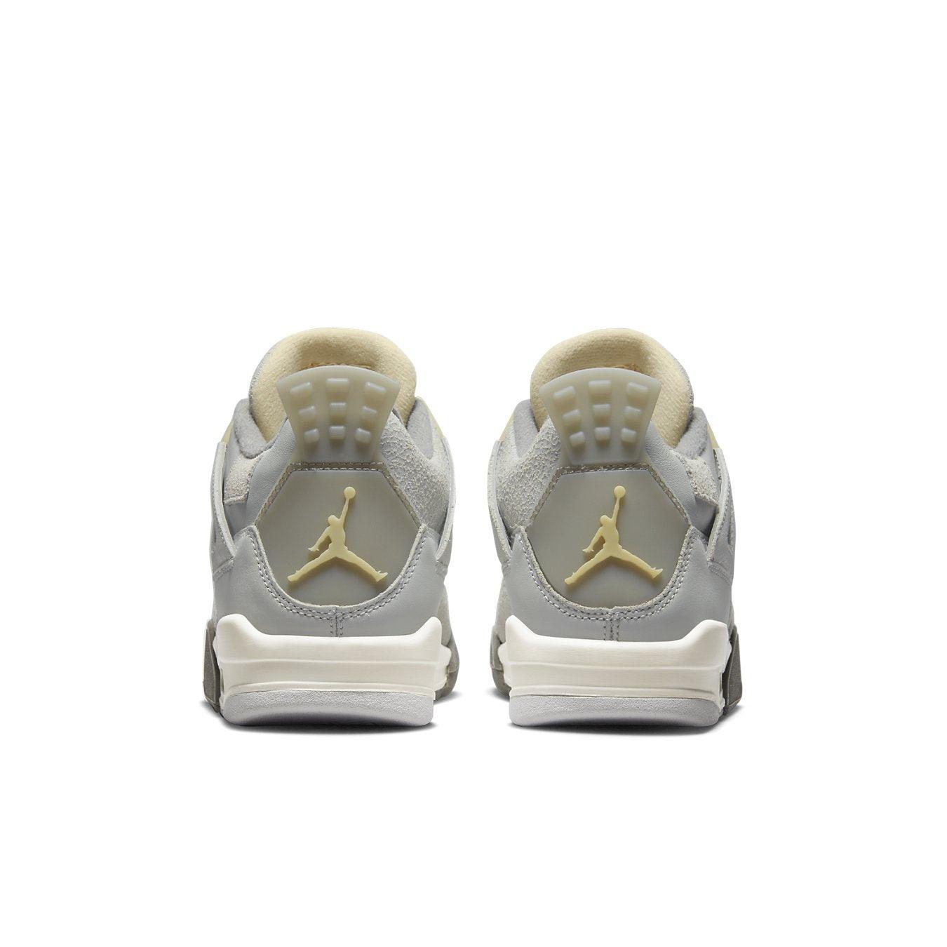 Back view of Air Jordan 4 Retro SE Craft Photon Dust sneaker for kids, featuring gray and cream colors.