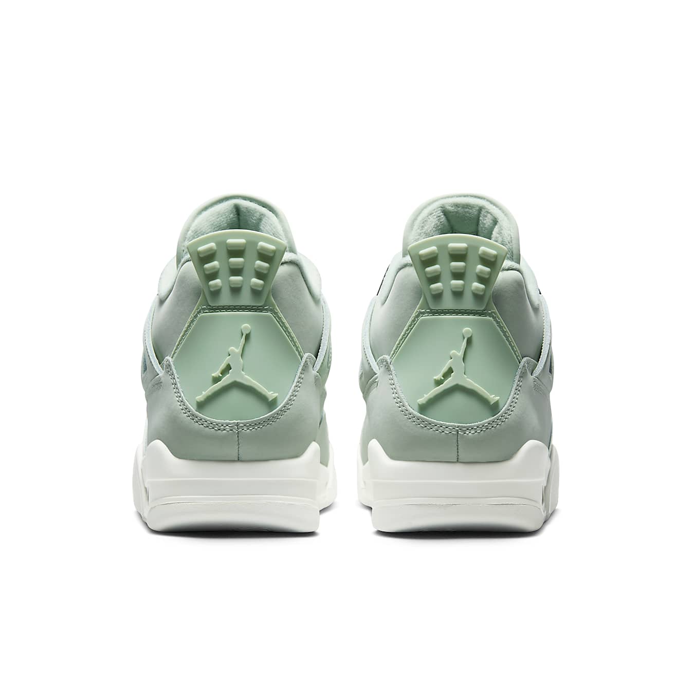 Jordan 4 Retro Seafoam Sail women's sneakers, featuring a mint green and white design from the back view.