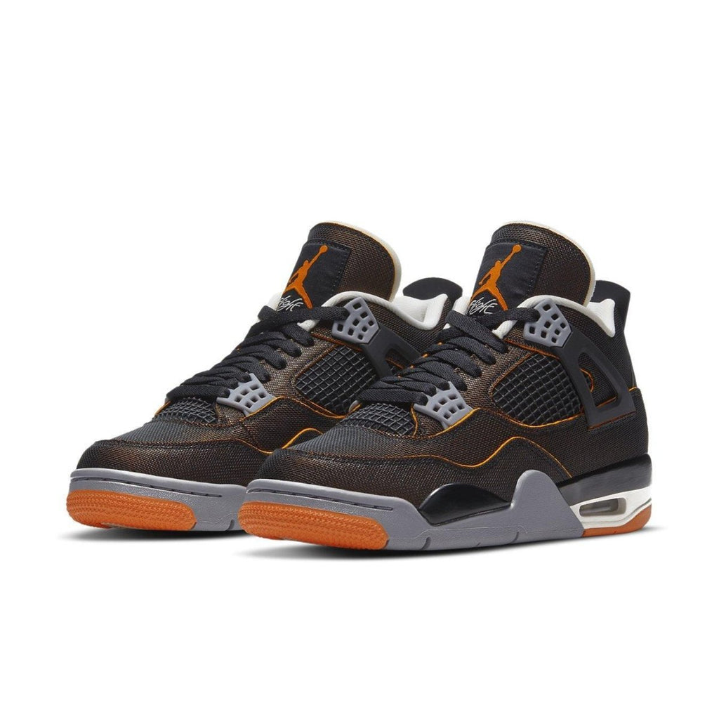 Air Jordan 4 Retro Starfish sneakers in black mesh and Starfish orange, featuring grey Jumpman logo and cut-out design.