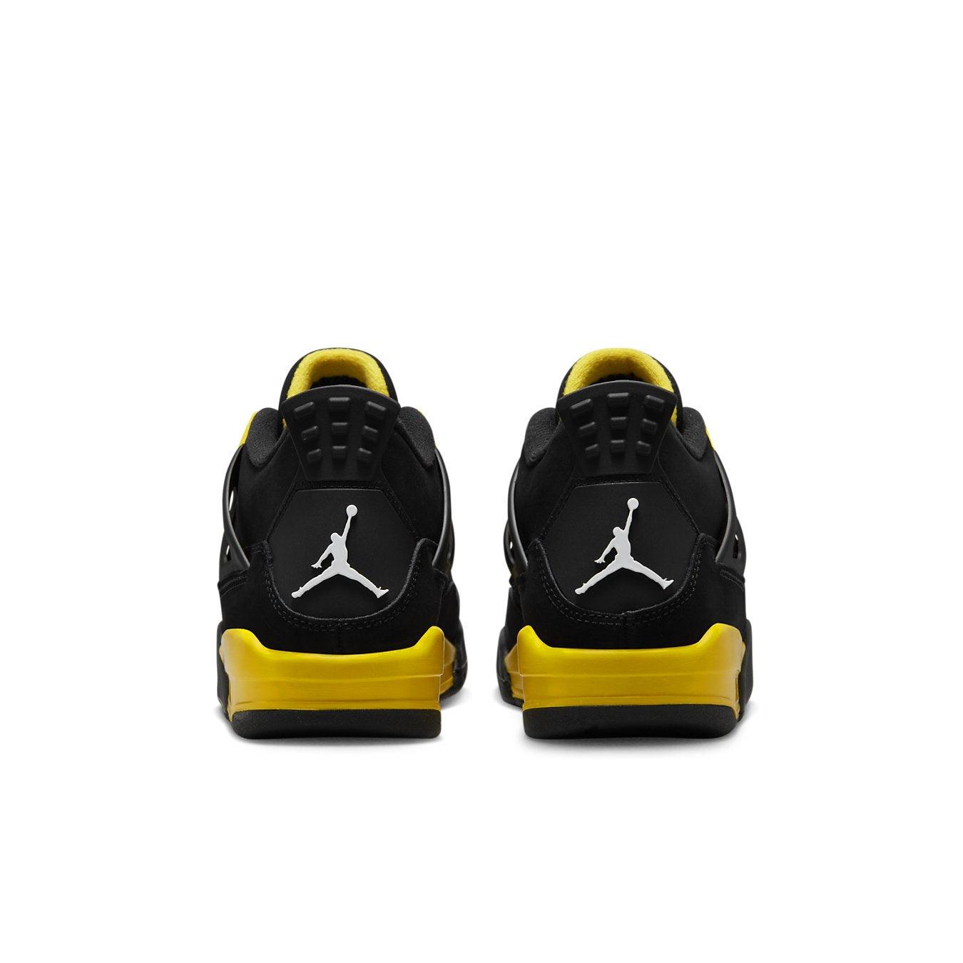 Air Jordan 4 Retro Thunder 2023 GS black and yellow sneakers from the back view.
