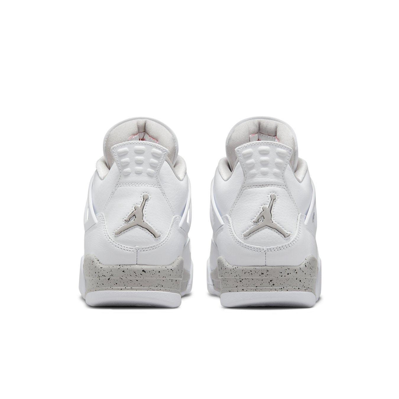 Air Jordan 4 Retro White Oreo 2021 sneakers, featuring a white leather upper and cement detailing on the heel.