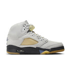 Air Jordan 5 Retro A Ma Maniére 'Dawn' Women’s sneaker in light gray leather with unique netting and A logo.
