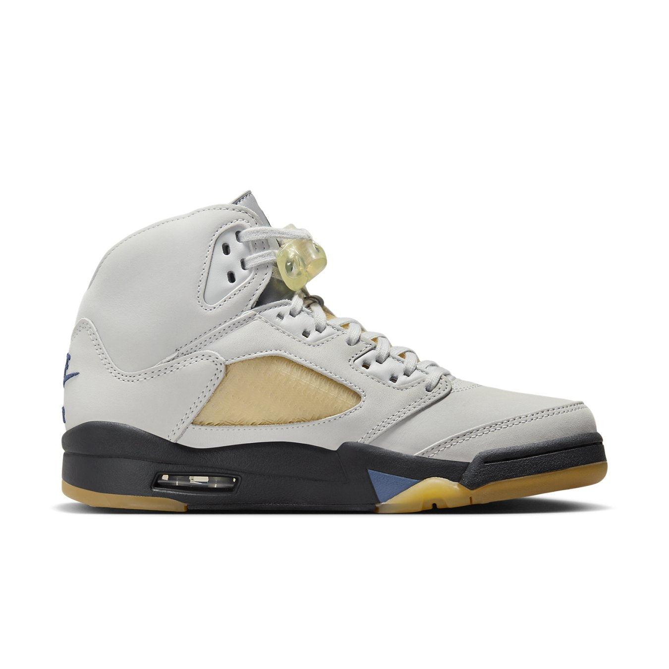 Air Jordan 5 Retro A Ma Maniére 'Dawn' Women’s sneaker in light gray leather with unique netting and A logo.