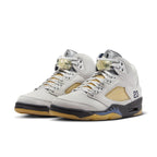 Women’s Air Jordan 5 Retro A Ma Maniére ‘Dawn’ in light gray leather with unique netting and logo.