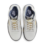 Top view of women's Jordan 5 Retro A Ma Maniére Dawn sneaker with light grey leather and unique netting.