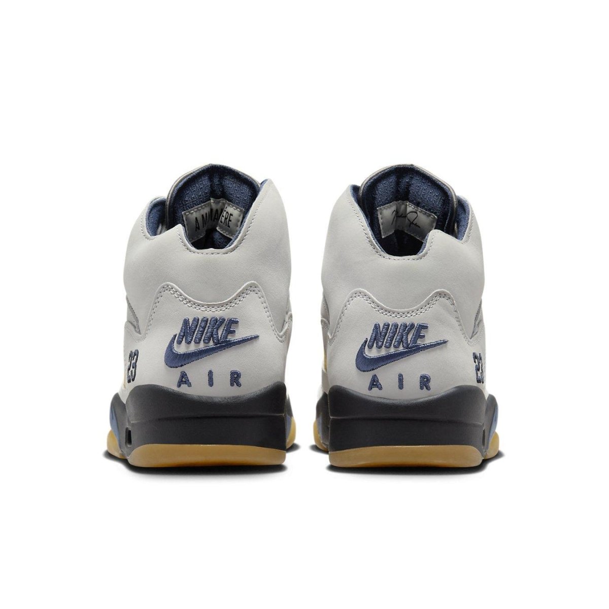 Back view of the women's Air Jordan 5 Retro A Ma Maniére Dawn sneakers featuring gray leather and navy accents.