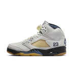 Women’s Air Jordan 5 Retro A Ma Maniére 'Dawn' in light grey leather with unique mesh and logo detailing.