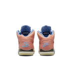 Back view of Jordan 5 Retro DJ Khaled We The Best in Crimson Bliss with signature branding and blue accents.