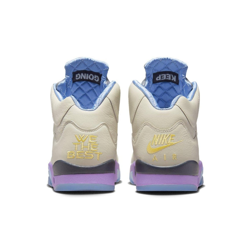 Back view of DJ Khaled x Air Jordan 5 Retro 'Sail' sneakers featuring pastel accents and 'We The Best' branding.