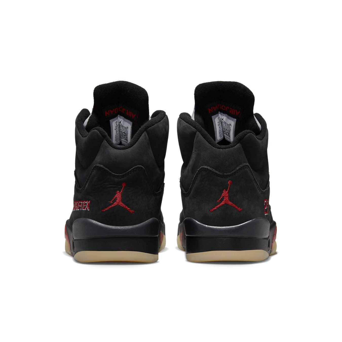 Rear view of women's Jordan 5 Retro Gore-Tex Off-Noir with red Jumpman logo and nubuck material.