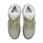 Top view of Air Jordan 5 Retro Jade Horizon sneakers featuring pale green suede and yellow accents.