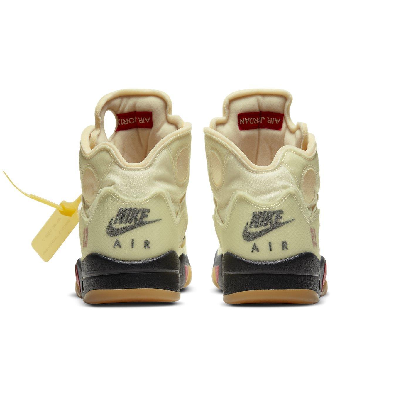 Back view of Nike Air Jordan 5 Retro OFF-WHITE Sail shoes, showcasing translucent material and Fire Red details.