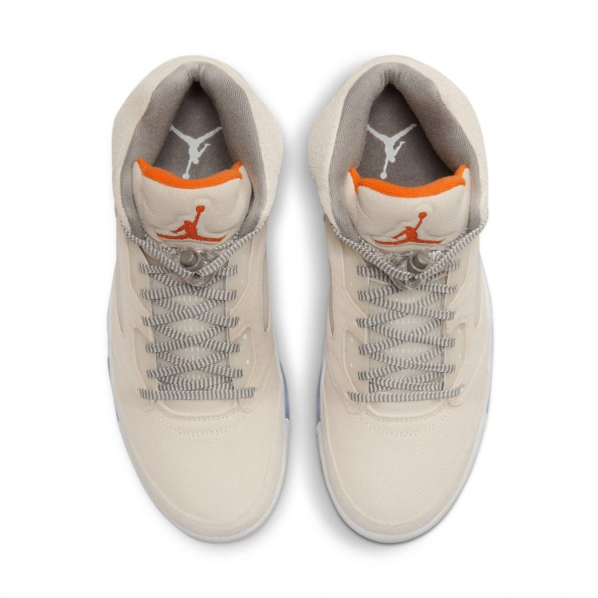 Top view of Jordan 5 Retro SE Craft Light Orewood Brown sneakers featuring beige suede and bright orange accents.
