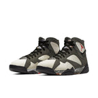 Jordan 7 Retro Patta Icicle sneakers with olive and white colorway, featuring a classic design and iconic branding.