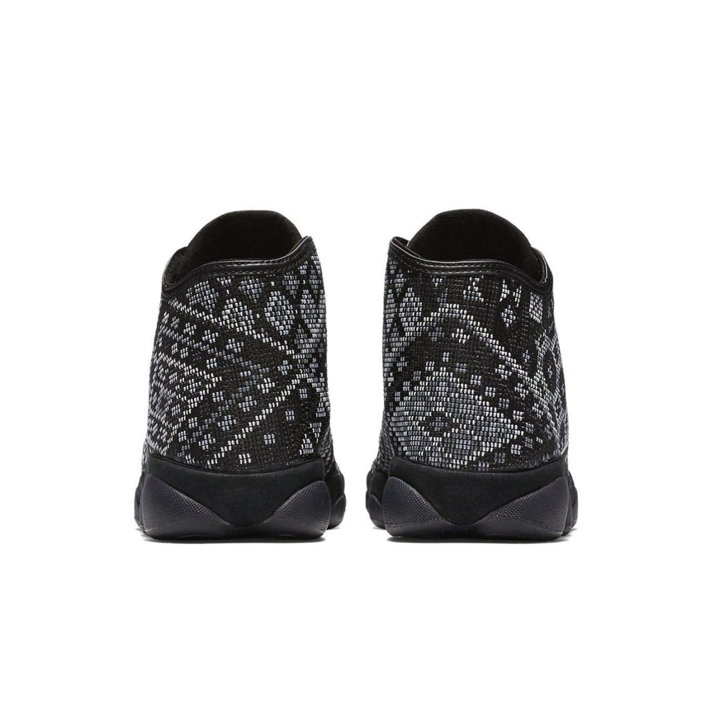 Rear view of Air Jordan Horizon PSNY showcasing unique black mesh upper with geometric patterns.