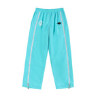 Mint and white NPT Simba La Rue zip track pants, featuring a relaxed fit and stylish design.