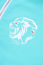 Close-up of Simba La Rue logo featuring a lion's head in white on mint green fabric.