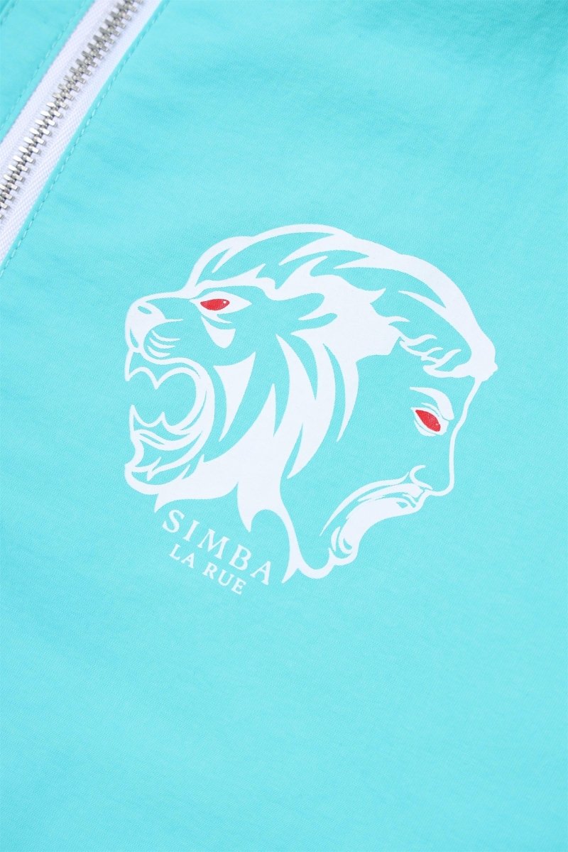 Close-up of Simba La Rue logo featuring a lion's head in white on mint green fabric.