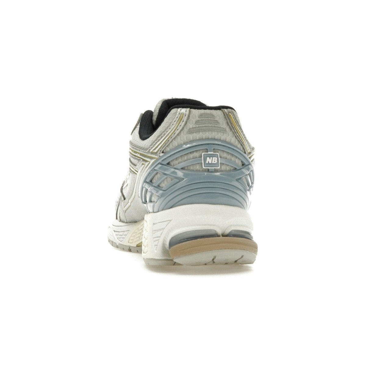 Rear view of New Balance 1906R Kith White sneakers showcasing breathable mesh and synthetic overlays.